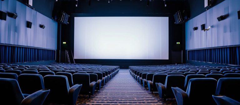 Empty cinema theater with a large blank screen, 4DX Explained