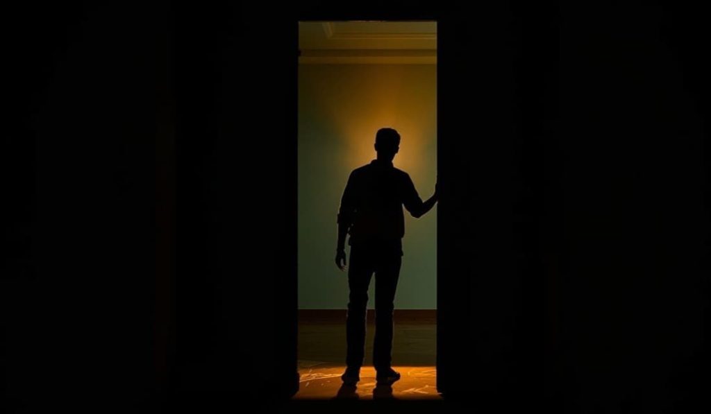 Silhouette of a man standing in a glowing doorway, from Barbarian Blu-ray Release Date