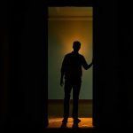 Silhouette of a man standing in a glowing doorway, from Barbarian Blu-ray Release Date